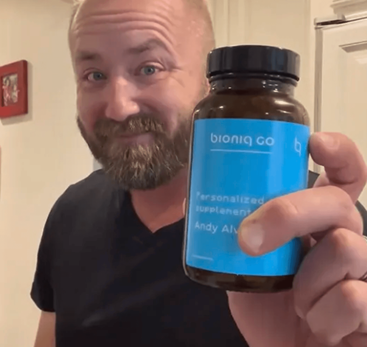 Bioniq customer holding a Bioniq bottle